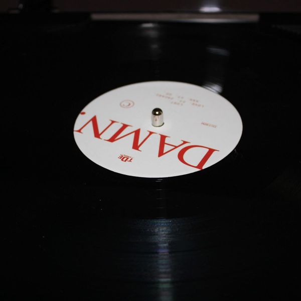 Vinyl record of Kendrick Lamar's album DAMN. on a turntable